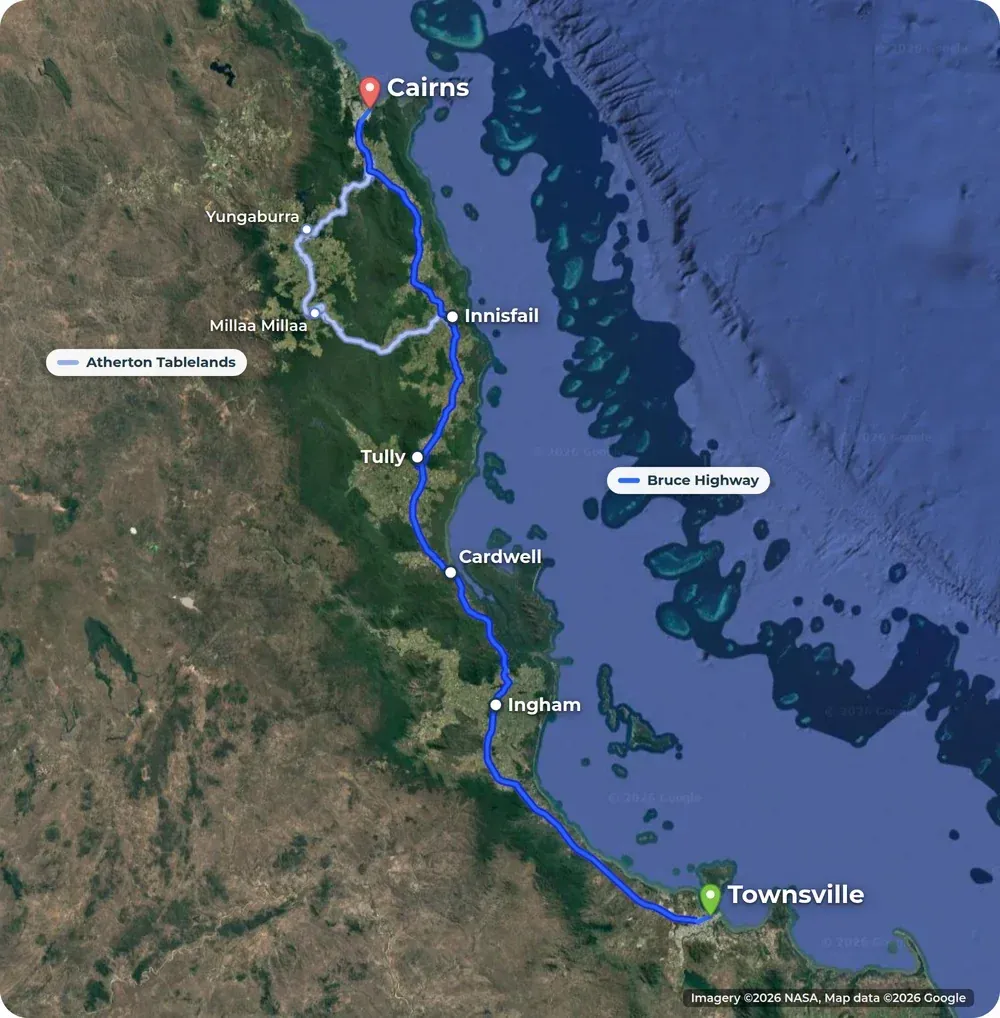 Satellite map of the north Queensland coast. The Bruce Highway runs from Townsville to Cairns in dark blue past Ingham, Cardwell, Tully and Innisfail. A lighter line shows the Atherton Tablelands road through Millaa Millaa and Yungaburra.